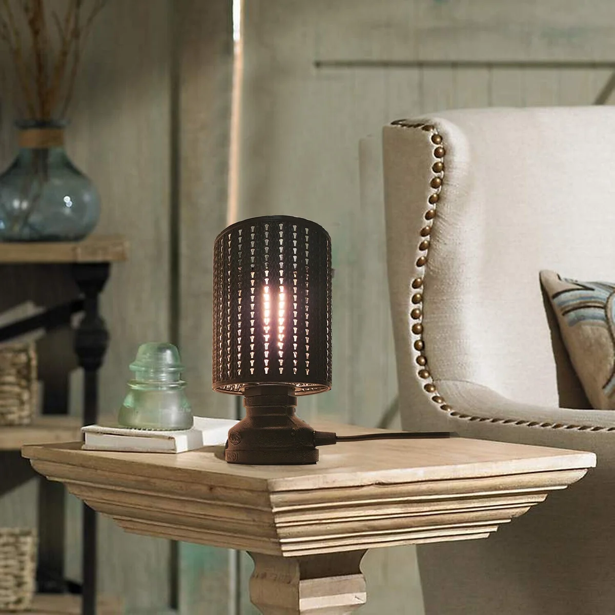 Industrial table lamp with antique brass metal wire cage and matte black lampshade, featuring E27 socket and on/off switch