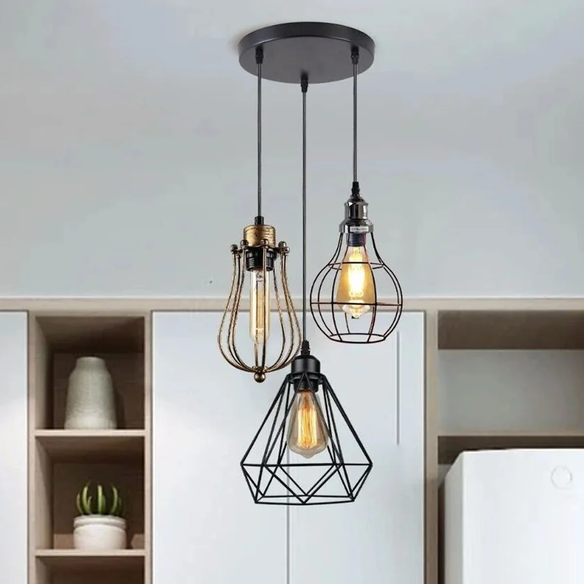 Modern pendant light with matte finish and angled cage, three E27 holders, metal and PVC construction, includes hook