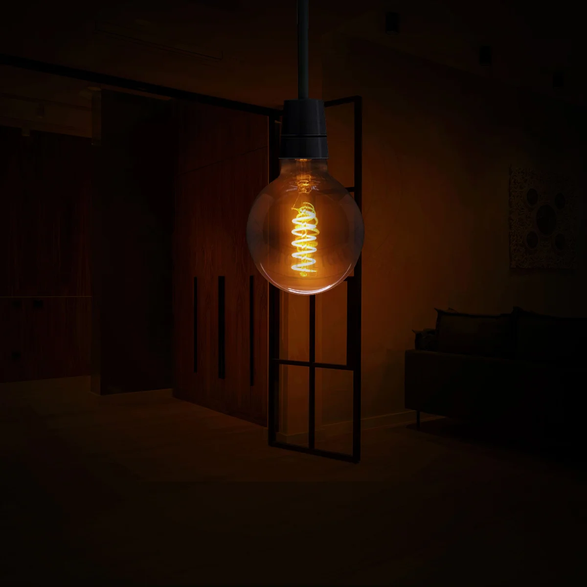 Vintage LED bulb with spiral filament, amber glow, glass body and metal cap, suitable for warm indoor ambience.