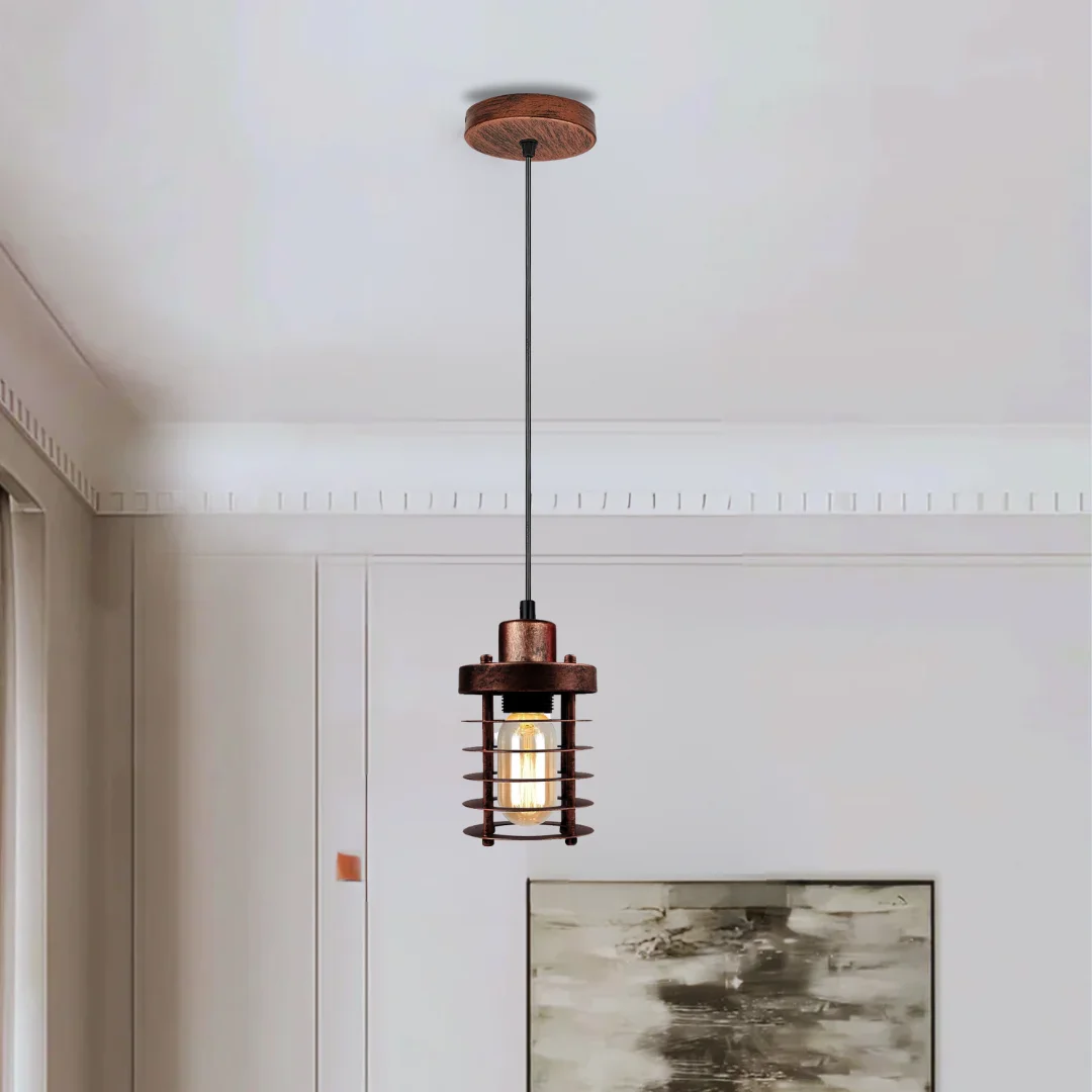 Rustic red pendant light featuring a metal cage, round base and hanging cable, hanging from ceiling