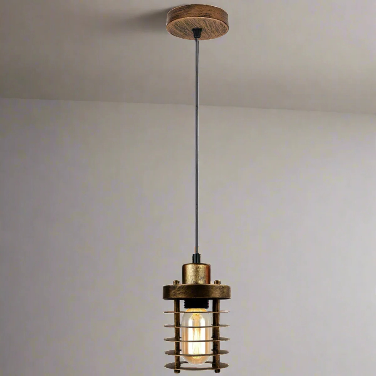 Round brushed copper cage pendant light hanging from ceiling, vintage style metal and PVC cage, clean modern design