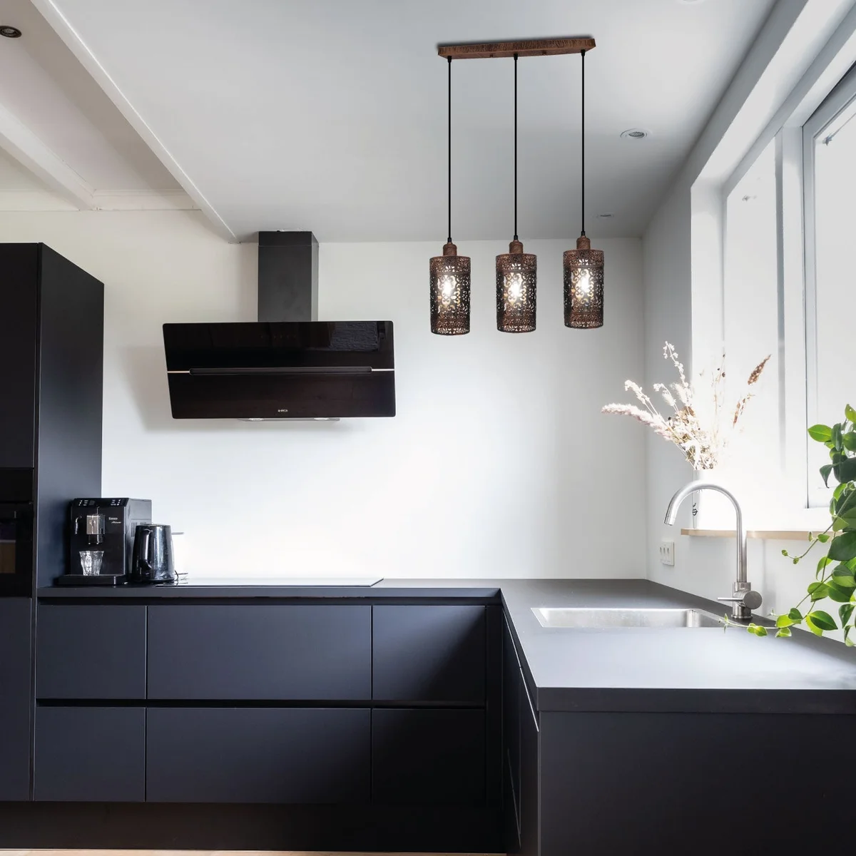 Three-brushed copper vintage pendant light kit with adjustable cord and metal cages on a ceiling base