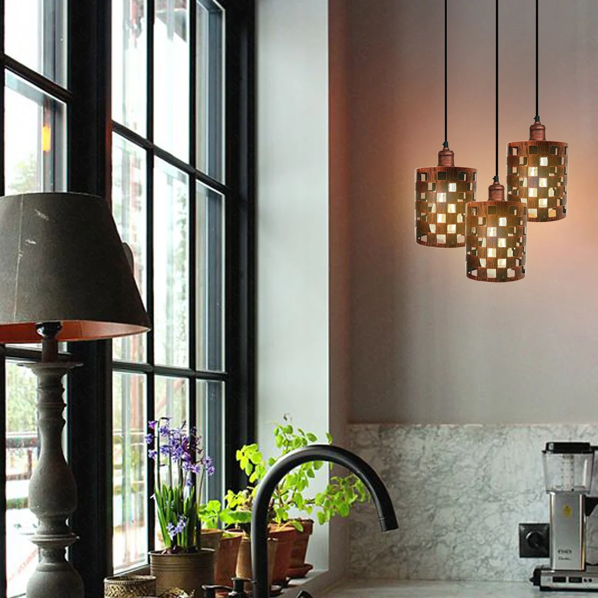 Three-head vintage pendant light with metal cage and rustic red finish, hanging from ceiling corner.