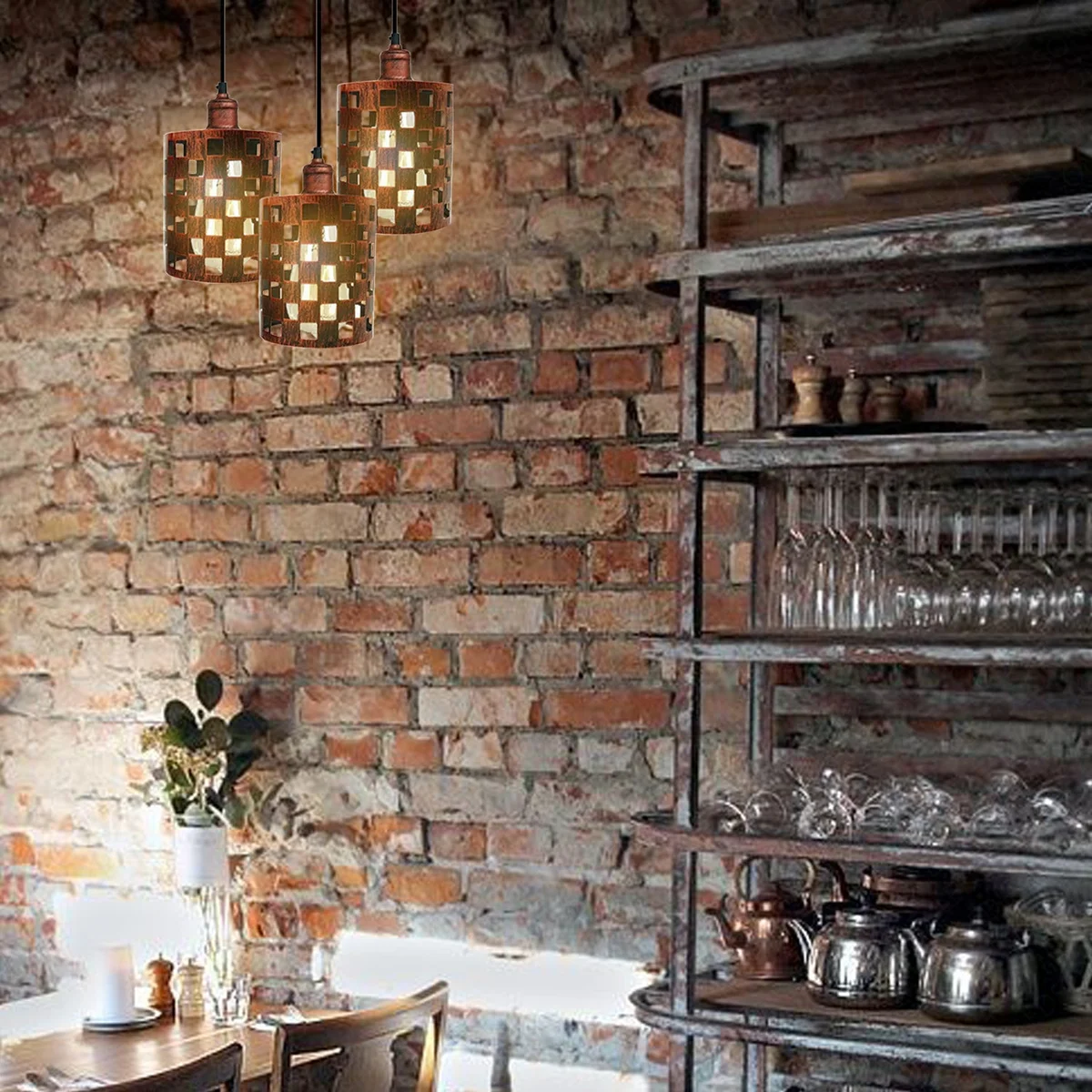 Vintage pendant light with three metal heads and candle‑style lamps hanging from a rustic red cage, visible in an indoor setting