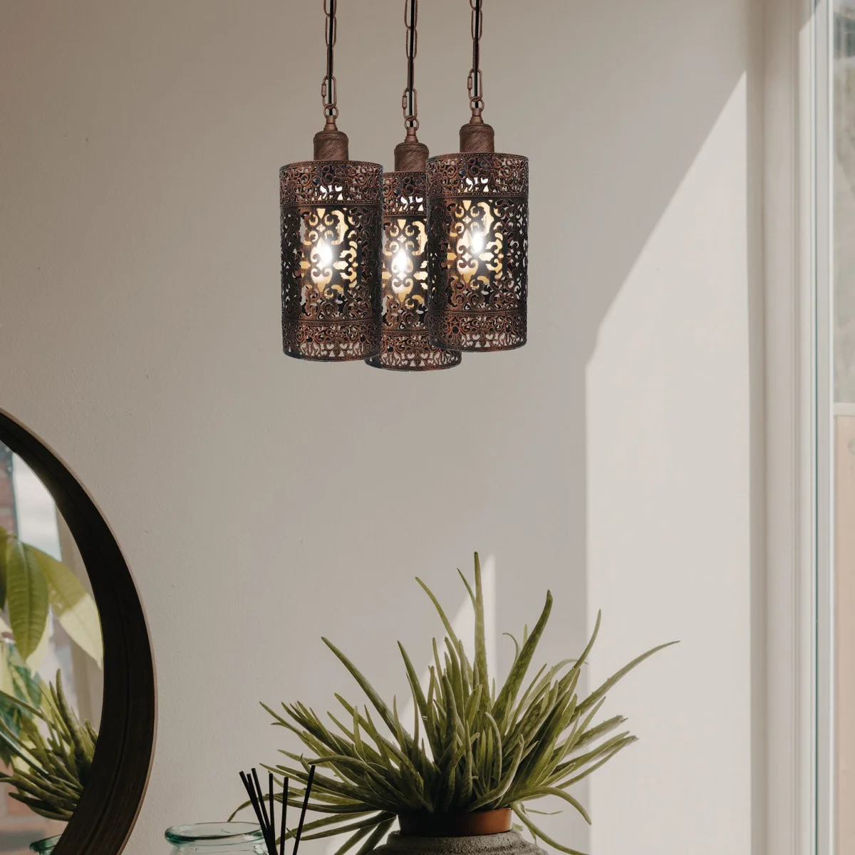 Black 3‑head pendant lamp with metal barrel cages and adjustable chains, dimmable ceiling lamp style