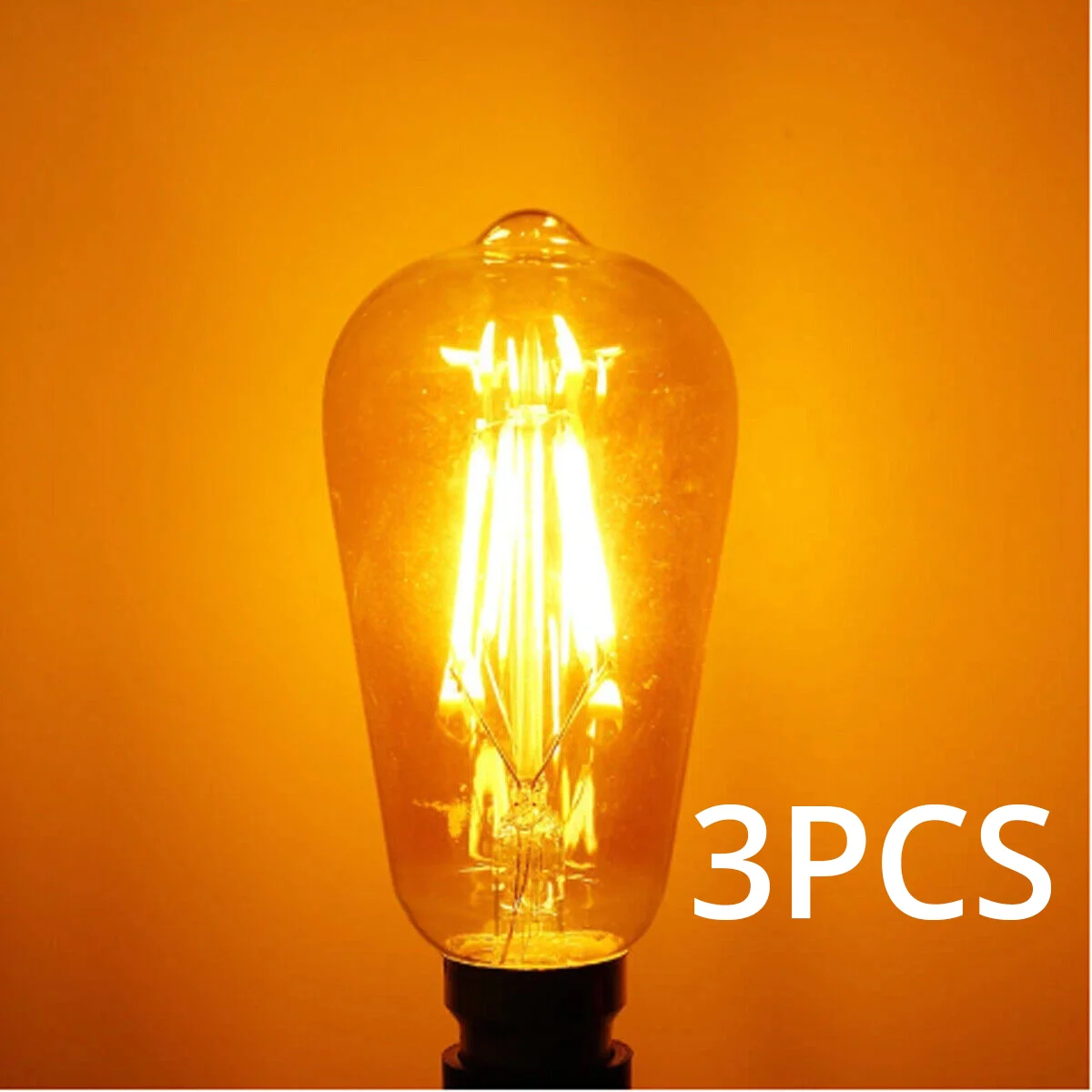 Group of amber ST64 LED filament bulbs with B22 base, glass and metal construction in clear packaging