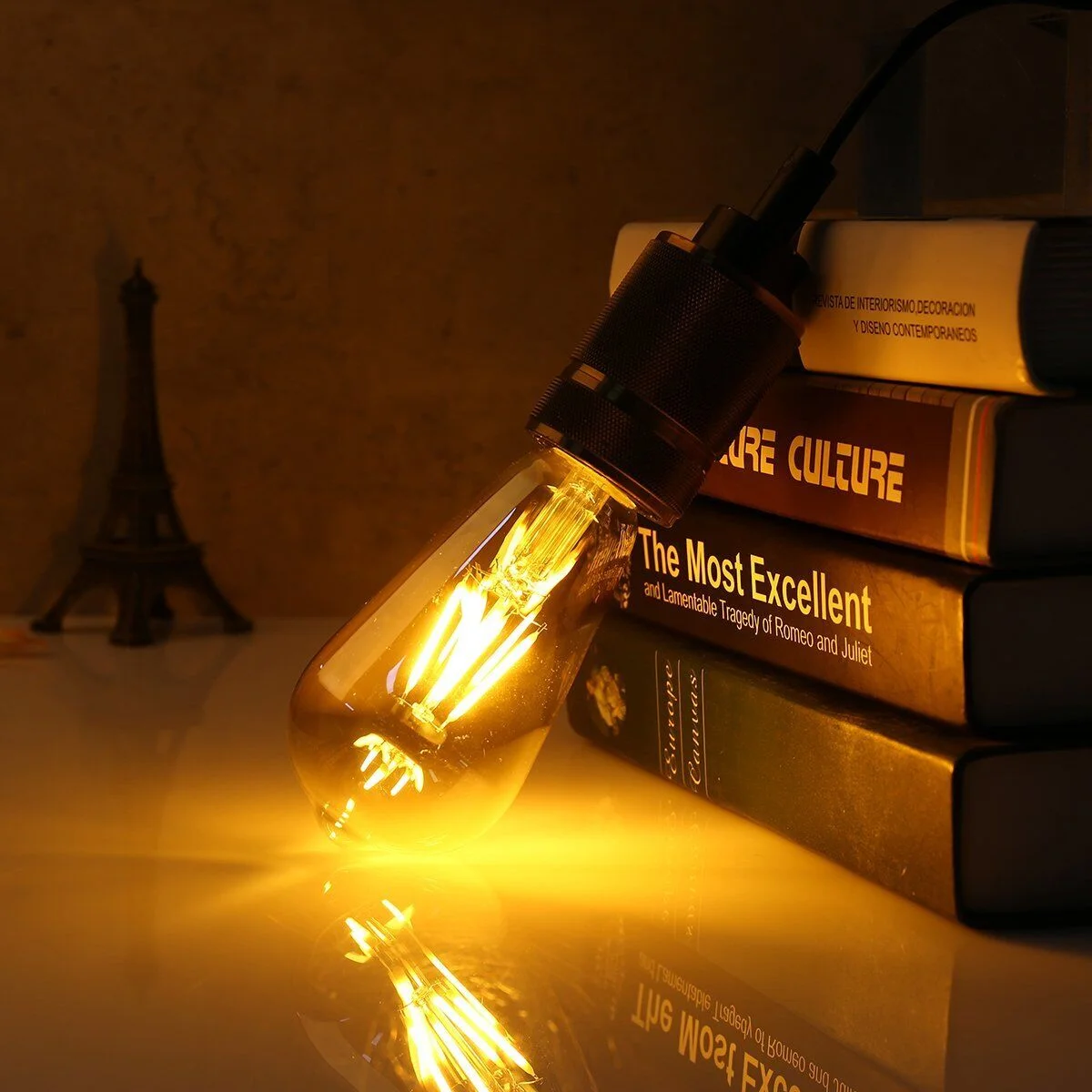 Package of amber LED bulbs with glass and metal B22 base, vintage Edison filament style, 4W each.