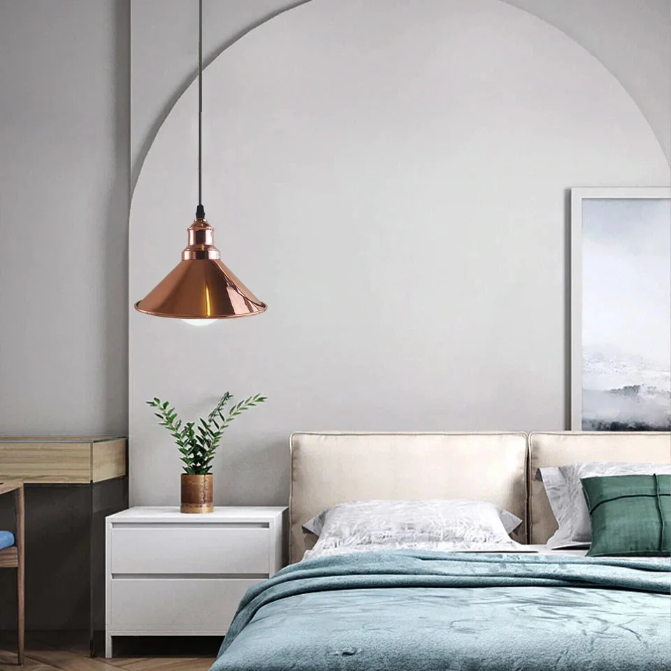 Rose gold pendant light featuring a metal cone shade with smooth finish and white inner layer, housed in a PVC base