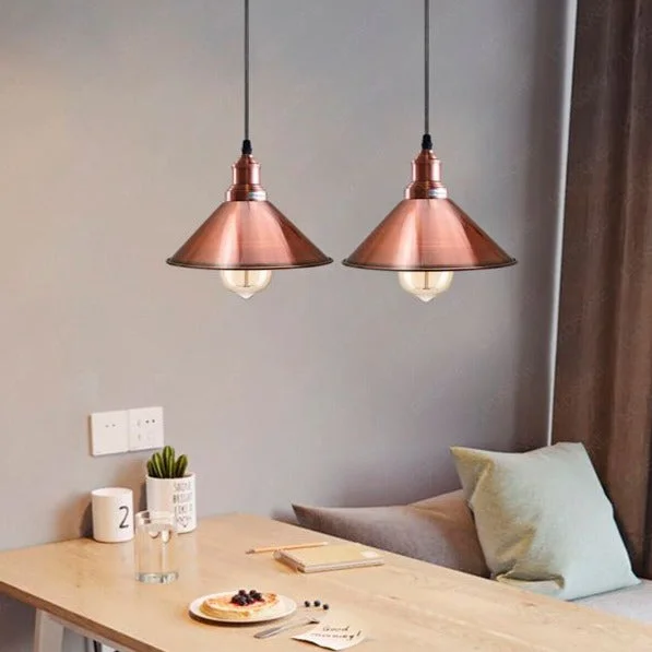 Rose gold pendant light with metal cone shade and E27 holder, mounted on ceiling.