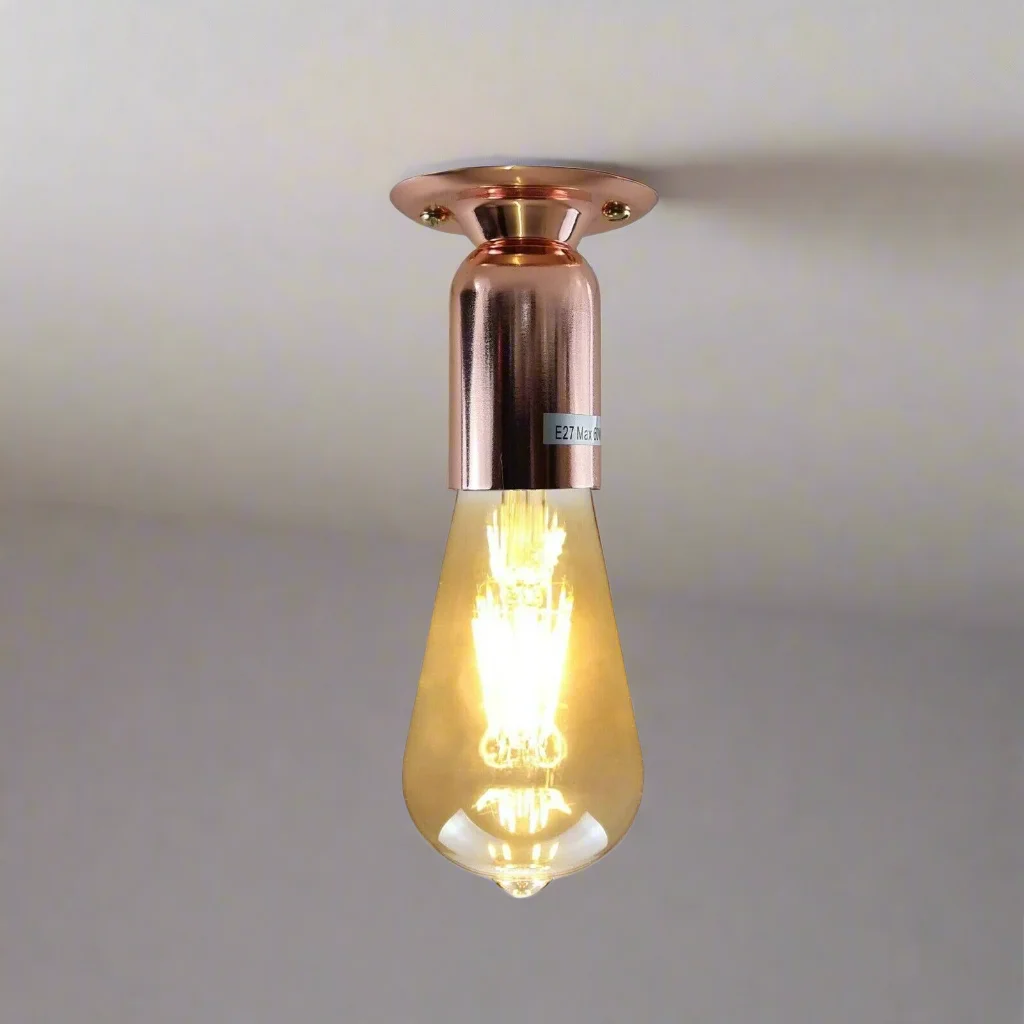 Compact rose gold ceiling light, sleek metallic finish, 7.5cm rose, 4cm wide E27 holder; minimalist for wall or ceiling.