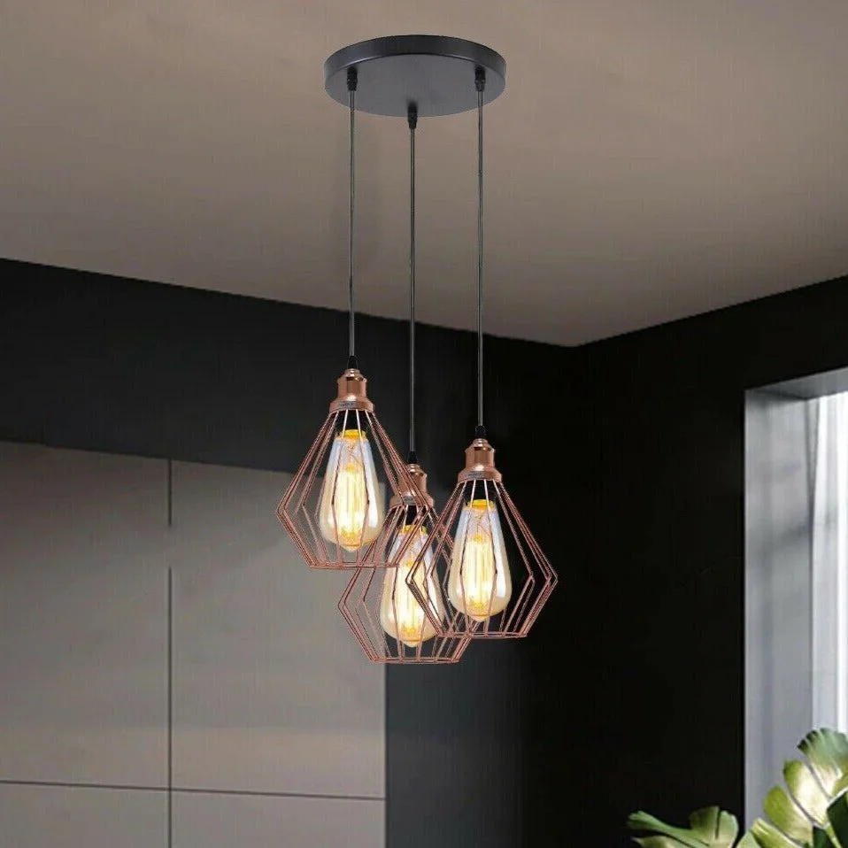 Three‑light pendant ceiling light in rose gold, metal housing with 95 cm PVC cable and E27 sockets, hanging overhead.