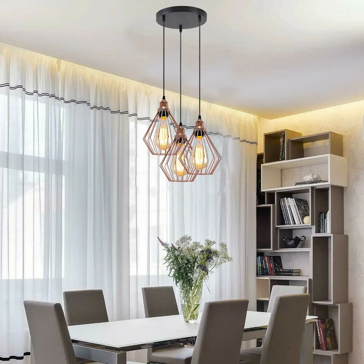 Rose gold ceiling light with three pendant LED bulbs on a metal and PVC frame, 95cm cable length, suspended from ceiling.