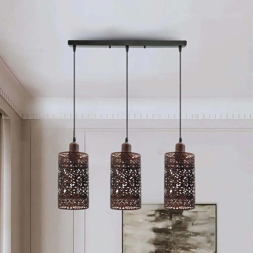 3 way pendant light with brushed copper cage, rustic style, hanging from ceiling, with 3 light holders and PVC cable.
