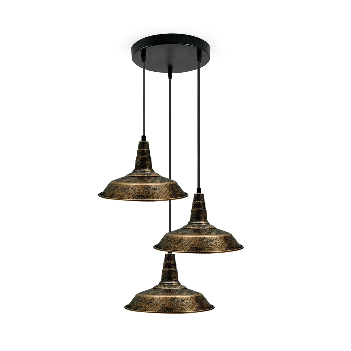 Three indoor cord pendant lights in brushed copper hang above a dining table.