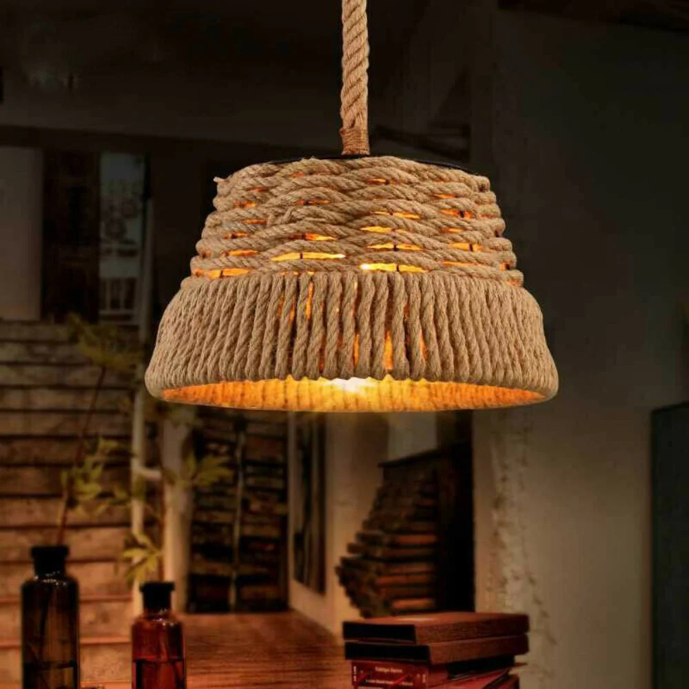 Industrial hemp pendant light with iron shade hanging from metal hook, hemp rope suspension, industrial style