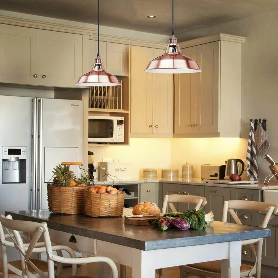 Vintage industrial metal adjustable ceiling light with copper finish and gold halo hood, angled for sloping kitchens.