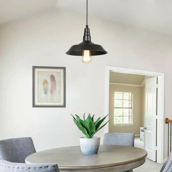 Black aluminium pendant lampshade hanging from adjustable wire, vintage style metal ceiling light.