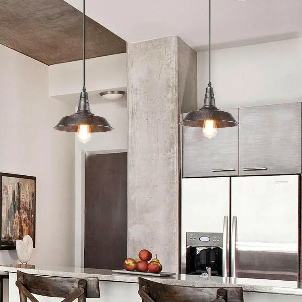 Vintage pendant ceiling light in brushed silver frame with black wire, hanging from ceiling, for kitchen or living room.