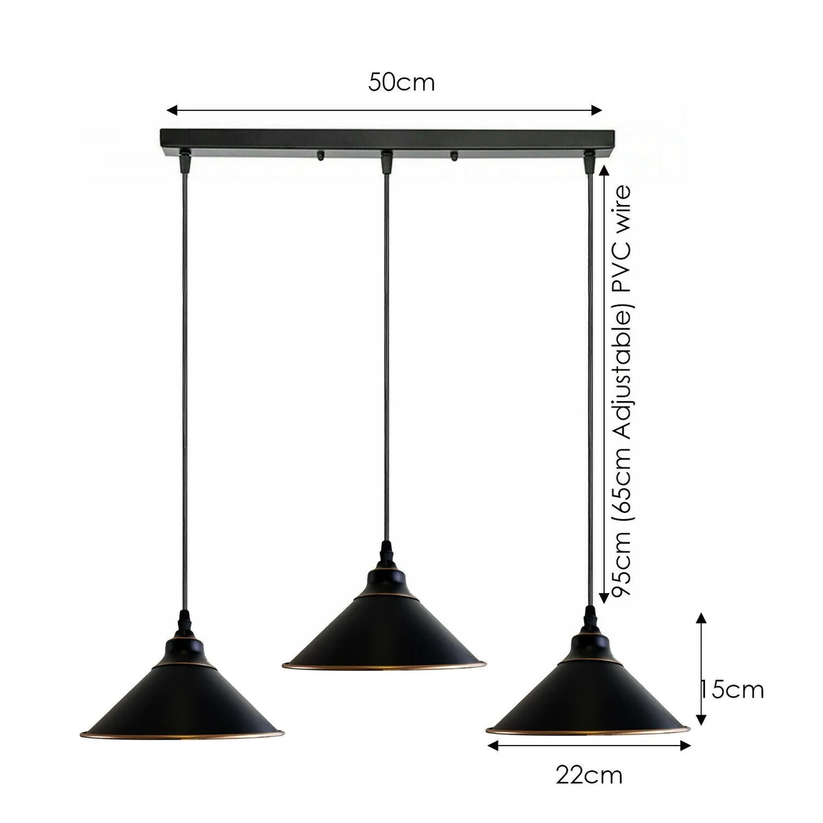 Black metal shade pendant with three Edison style bulbs, rustic industrial design, hanging over kitchen or dining area.