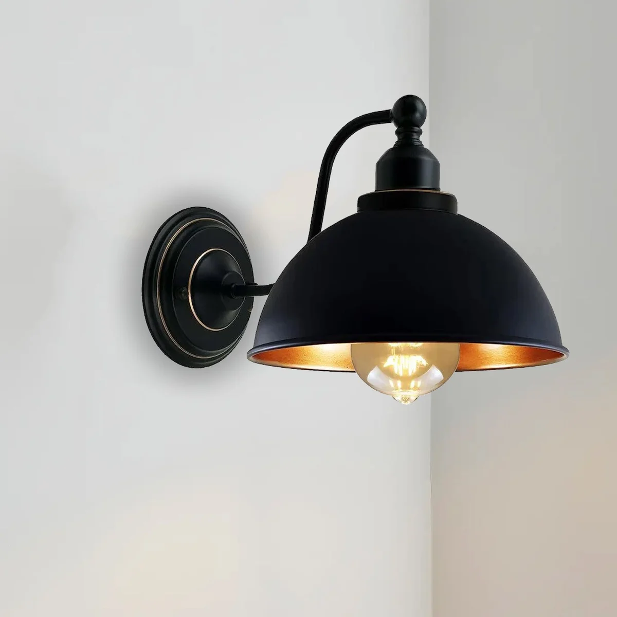 Blue 21cm metal dome bedside wall light with copper interior and curved mounting arm.