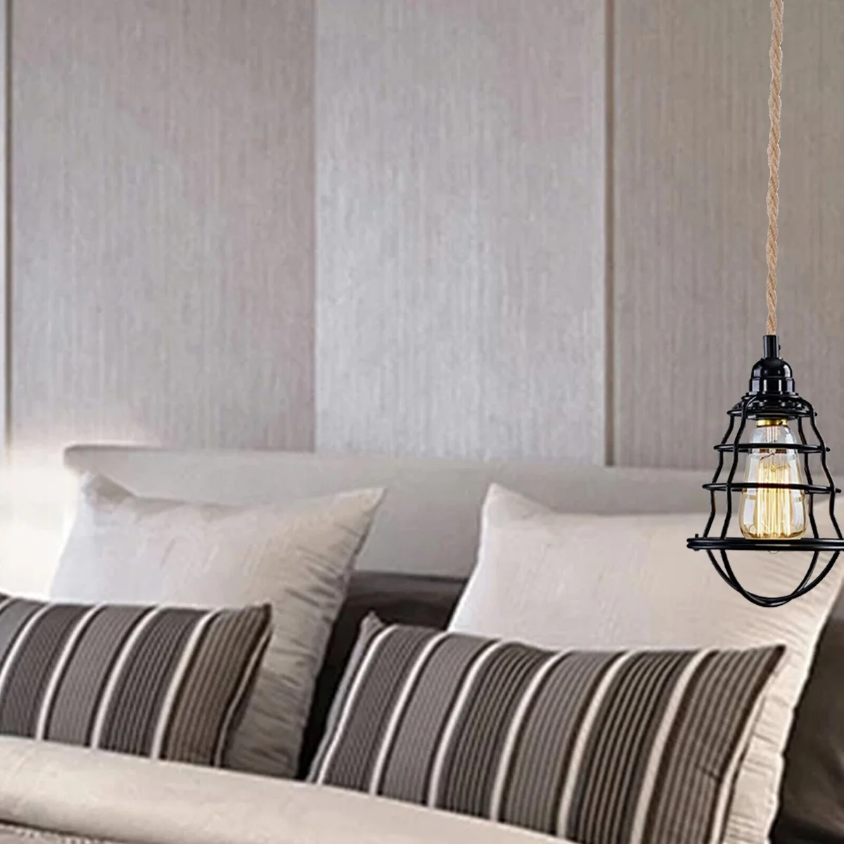 Plug in hanging light with black metal frame, hemp fabric-covered cable and black E27 holder, hanging from ceiling