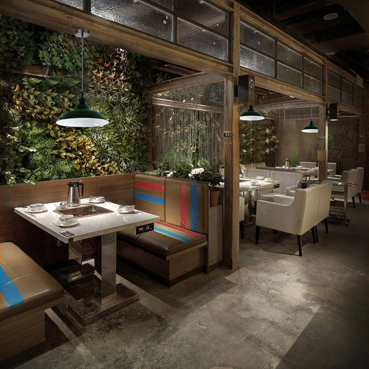 Green metal pendant light with slotted barn shade hanging from ceiling, 95cm curved cable and E27 socket.