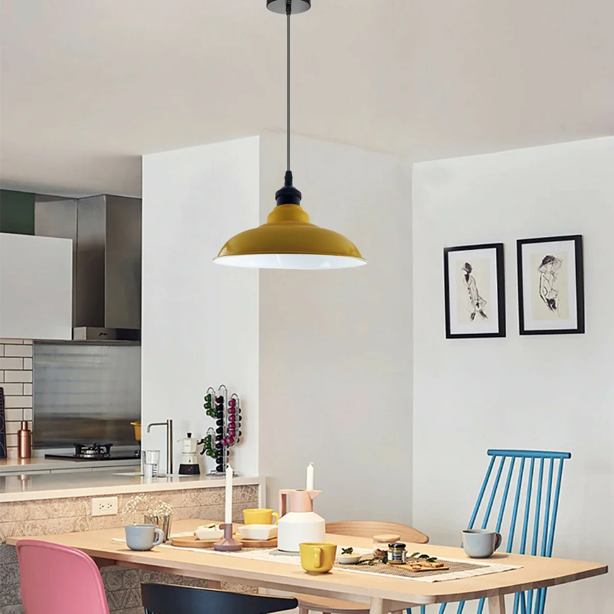 Yellow pendant light with metal base and white hood, angled to fit sloped ceilings above a kitchen island.