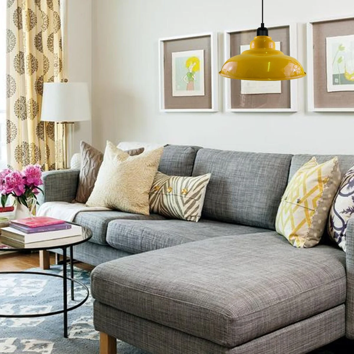 Yellow pendant light with painted metal body and white hood, angled for sloped ceilings over a kitchen island.