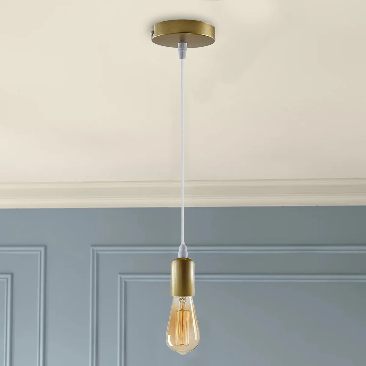 Modern pendant light featuring a large vintage metal lamp holder, yellow brass finish, 95cm black/gold fabric cable