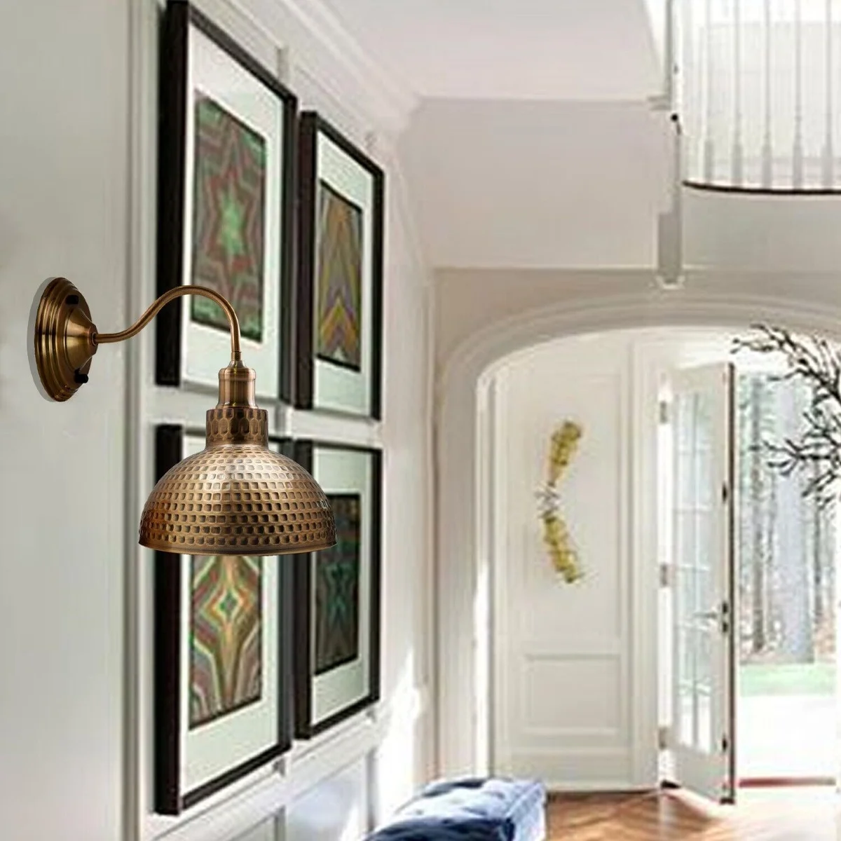 Copper industrial wall sconce with swan neck mount and dome shade, mounted on wall, warm metallic glow.