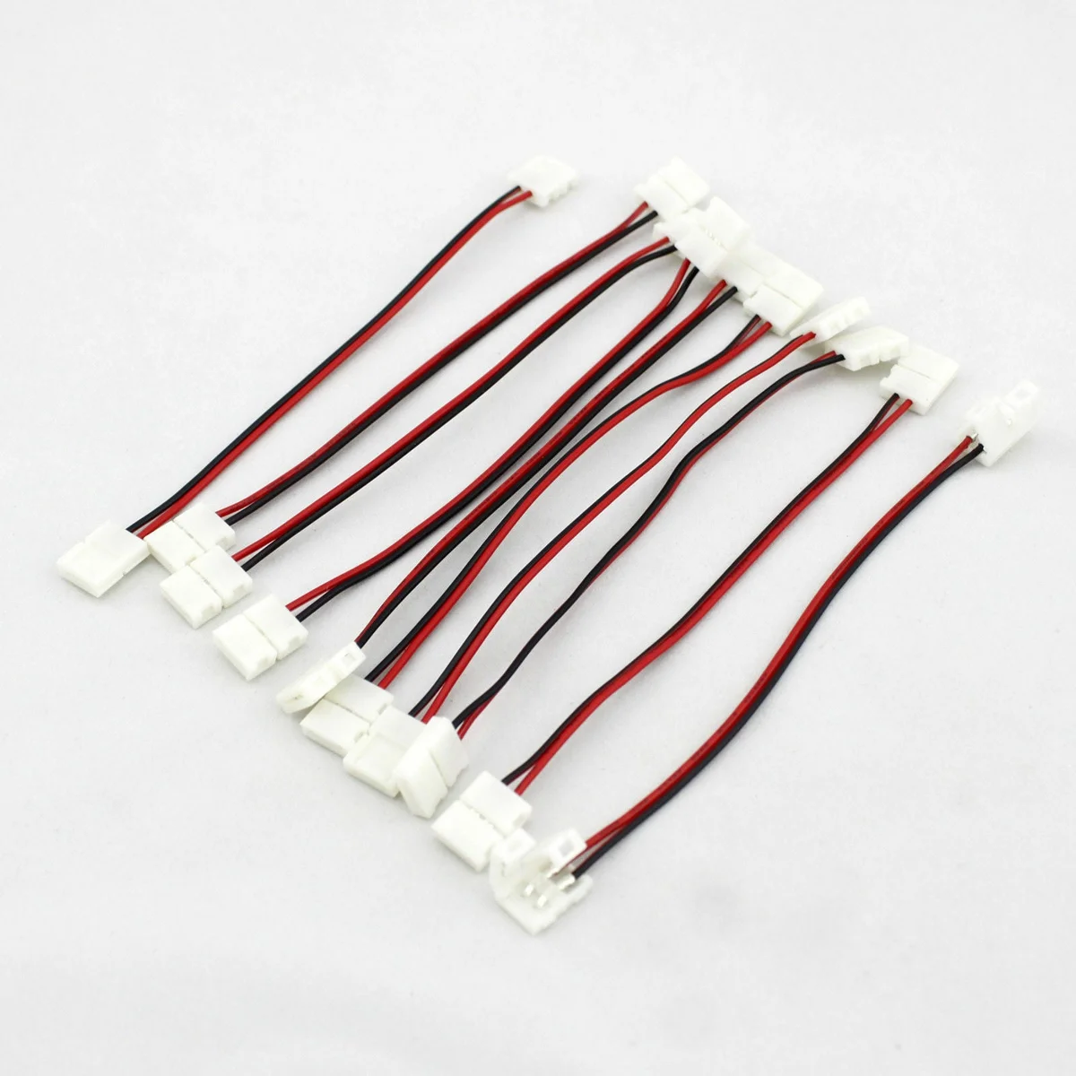 2 pin LED strip connector with plastic cover, sharp pins, brightly coloured leading wires, ready for clip-to-clip LED wiring.