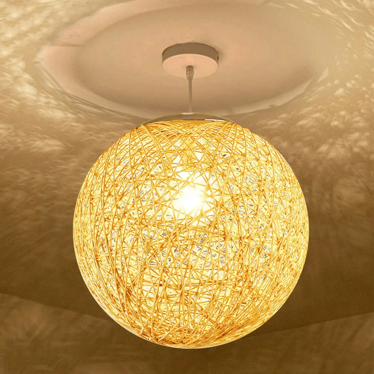 Yellow modern wicker lampshade hanging on a 95 cm iron frame, rattan wicker sphere glowing warm LED light.