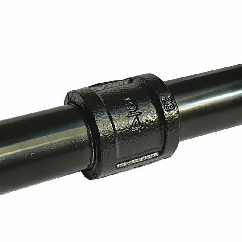 Black cast-iron 3/4” pipe flange with four mounting holes, a rugged industrial pipe connector in true steam-punk style.