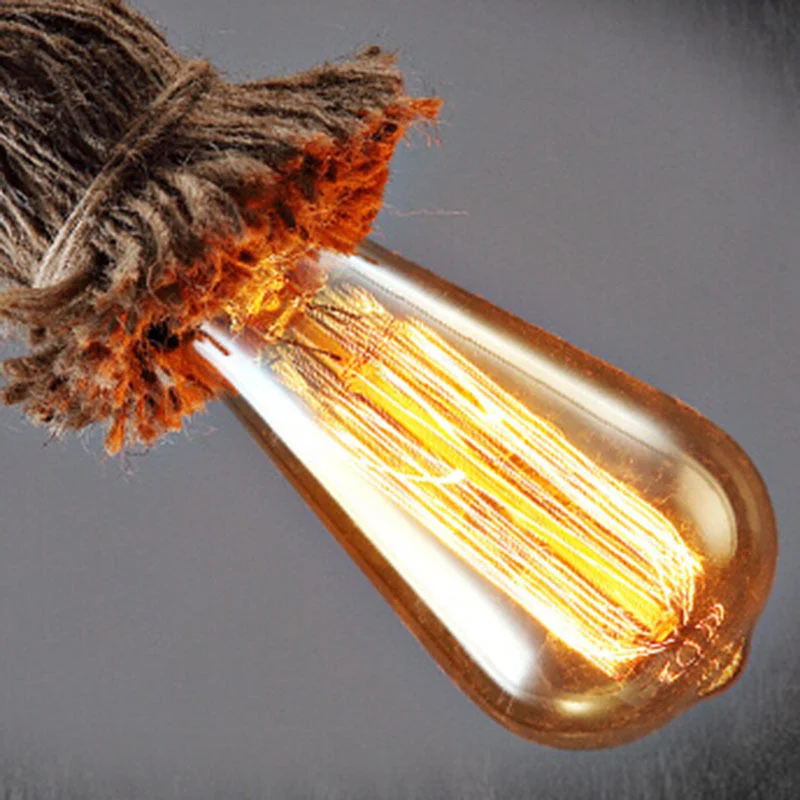 Rustic ceiling light featuring a tall hemp rope cable in a vintage pendant style.