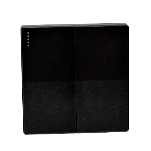 Brushed gold single-gang wall switch with a single button and screwless design, mounted on a standard UK light socket