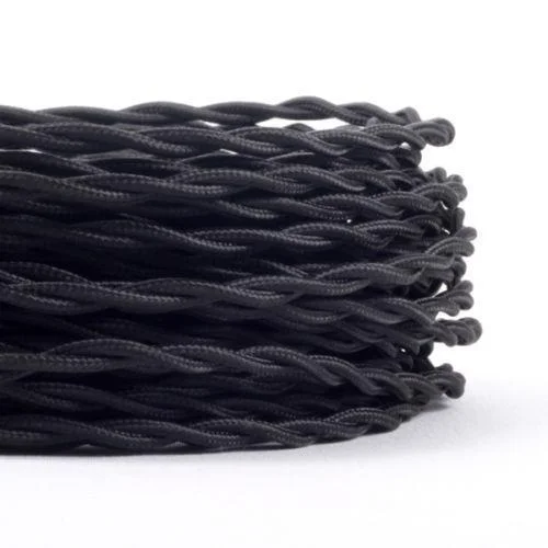Flexible lighting cable: black cloth‑covered, twisted 3‑core cable laid on flat surface showing braided appearance