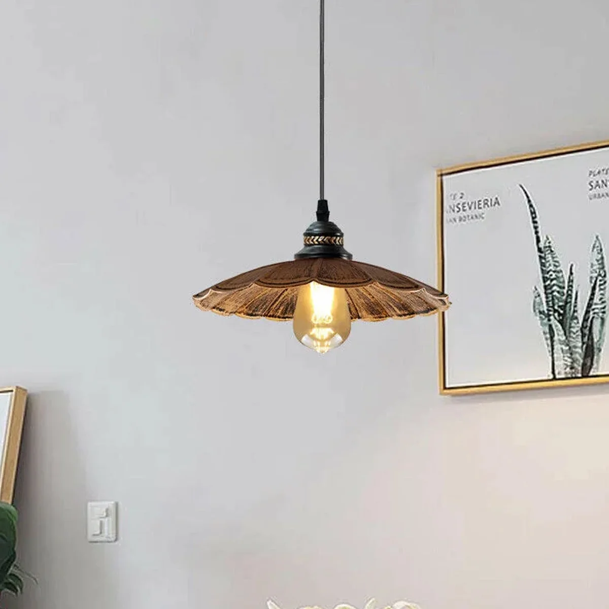 Retro pendant lamp with metal shade, long PVC cord, black finish, hanging above ceiling