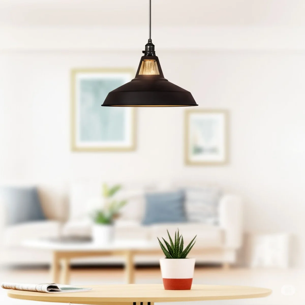 Industrial pendant light with brushed brass metal housing, integrated rotary switch, LED socket, hanging over a floor lamp shade.