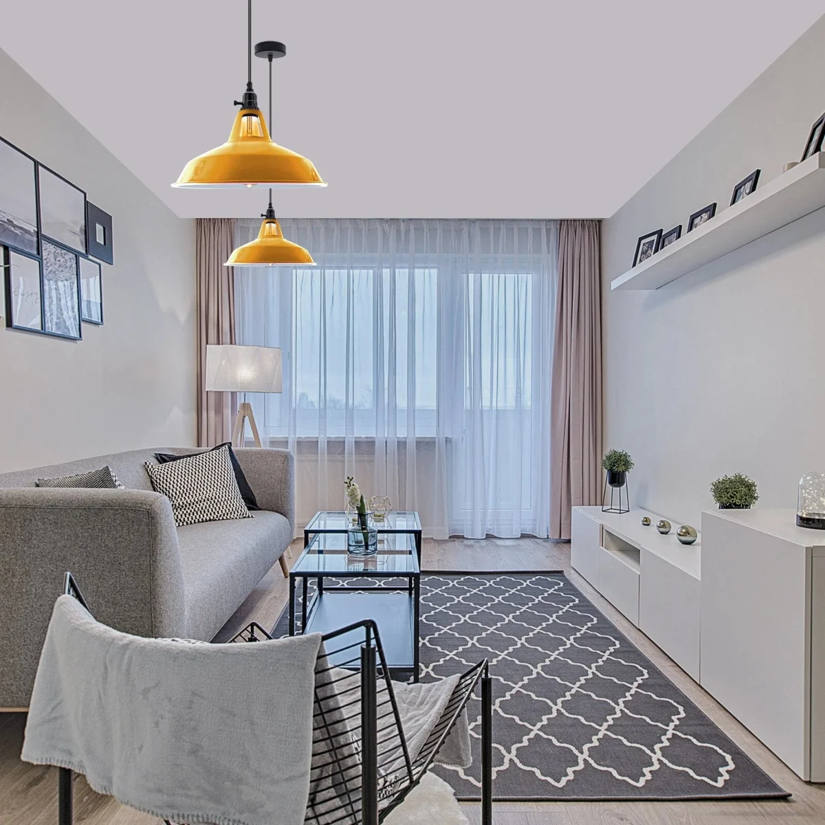 Vintage style ceiling light hanging from a metal pendant with integrated rotary switch and brushed brass finish.