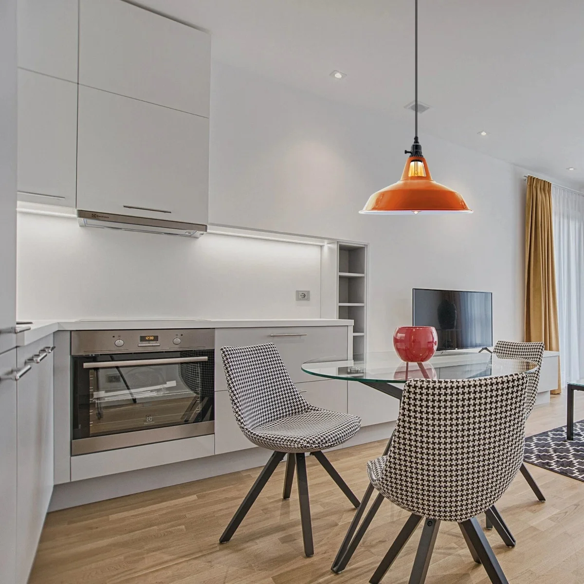 Modern industrial pendant light with metal housing, integrated rotary switch on lamp holder, finished in brushed brass.