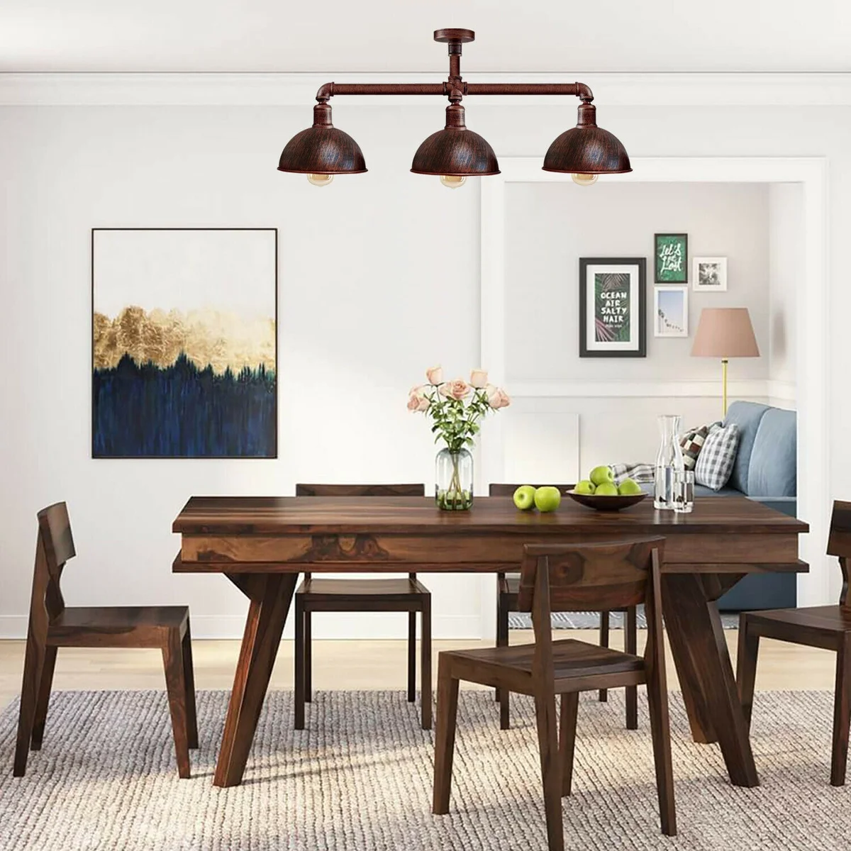 Three‑arm vintage industrial ceiling light hanging from ceiling, each arm holding an E27 bulb in metal pipe fixtures.