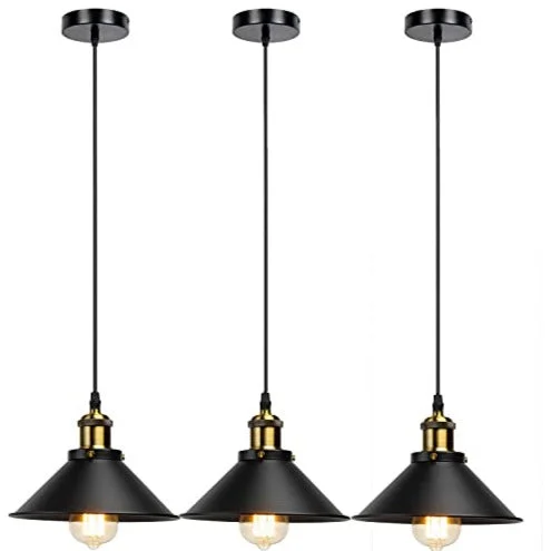 Three black ceiling lights with metal shades hanging from adjustable cords over a dining table.