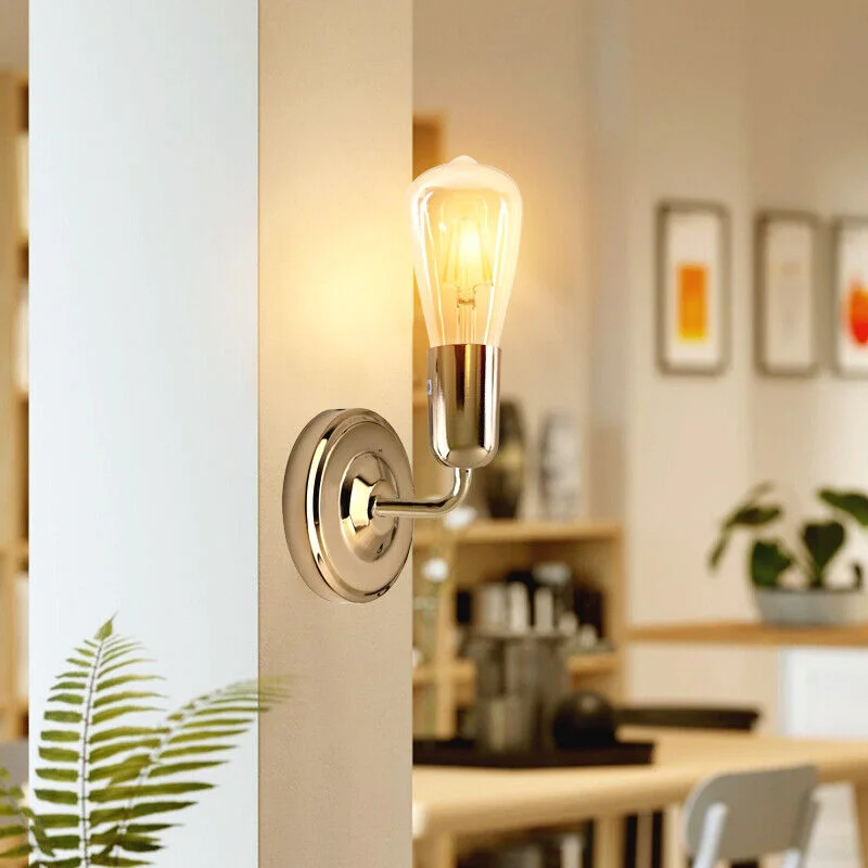 Indoor industrial lamp with metal arm and round socket, ready for wall mounting.