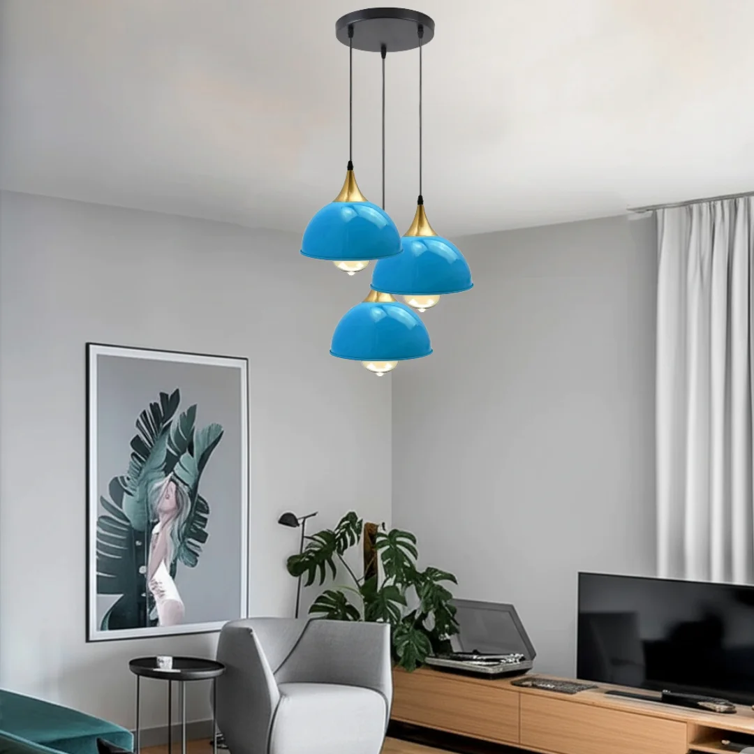 Blue ceiling pendant light with 3 matte blue domes on yellow brass base.