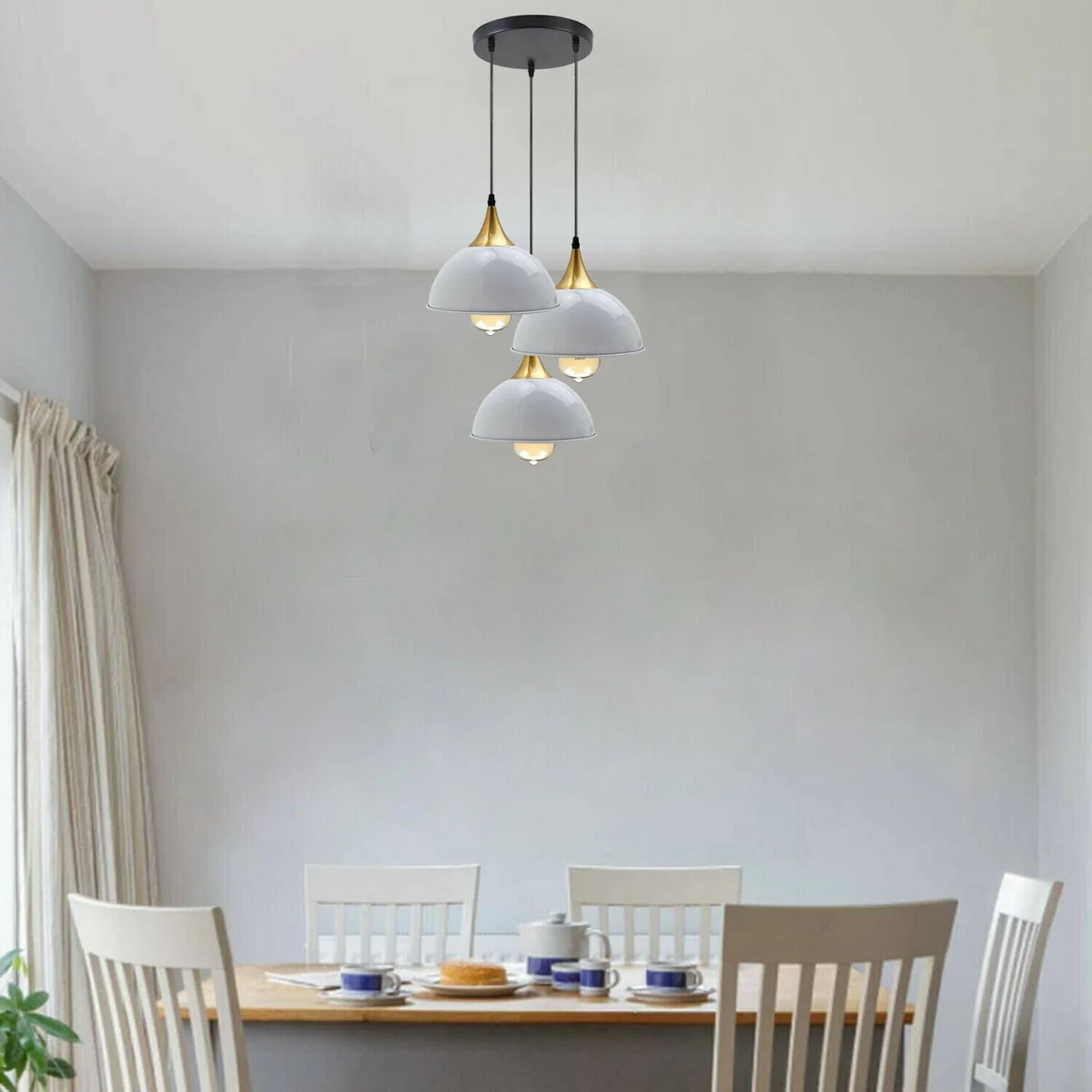 White gold pendant light with a painted white dome and yellow brass shade, 3 bulbs, modern industrial style.