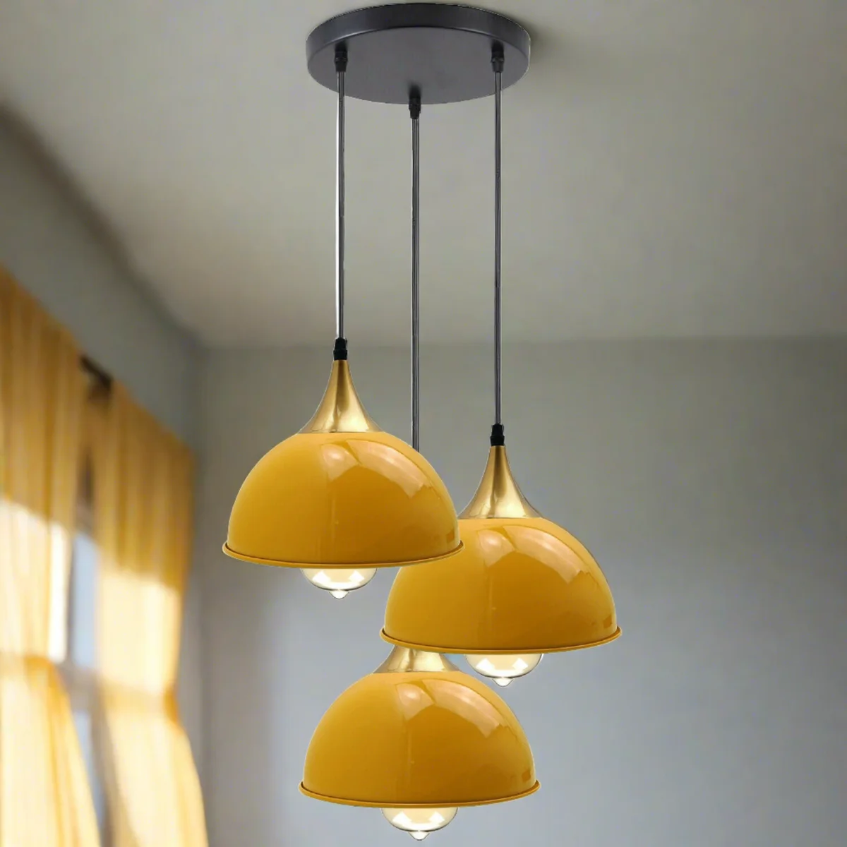 Modern yellow brass pendant ceiling light with three dome lampshades and white interior.