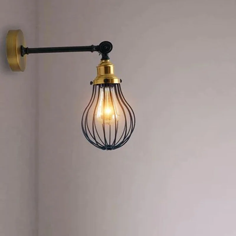 Adjustable wall sconce featuring a black brushed copper metal cage, vase‑shaped shade 13cm dia × 20cm tall.