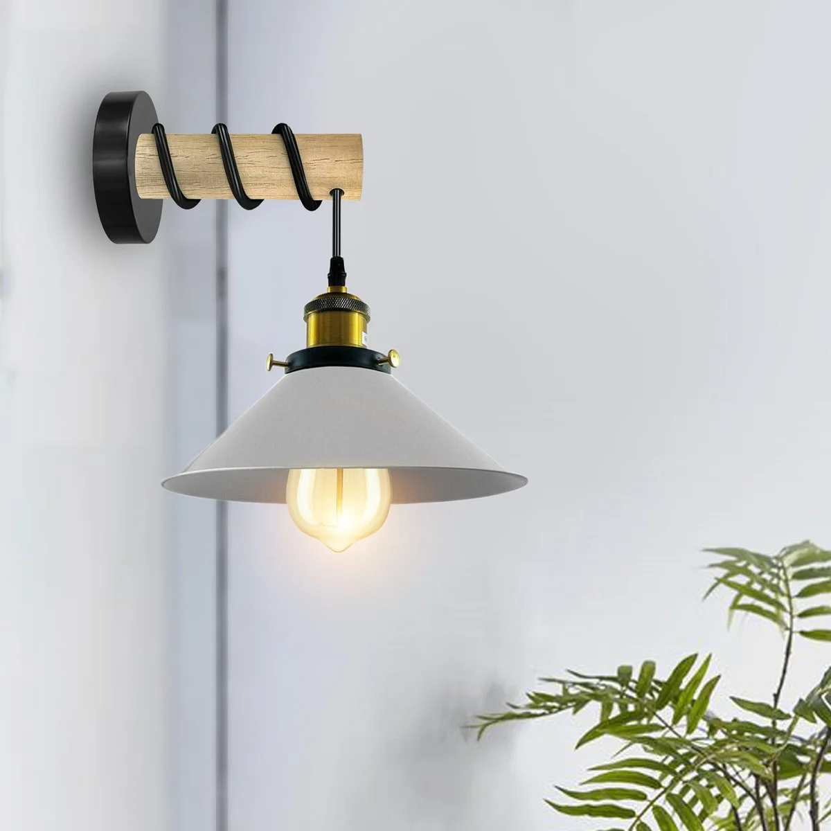 White metal cone shade on a wooden arm wall lamp, positioned to cast soft light.