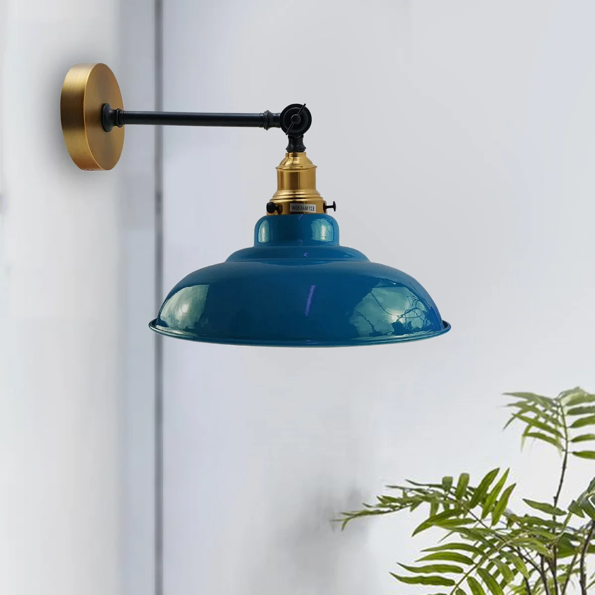 Adjustable wall lamp with cyan blue curved metal shade and swing arm.