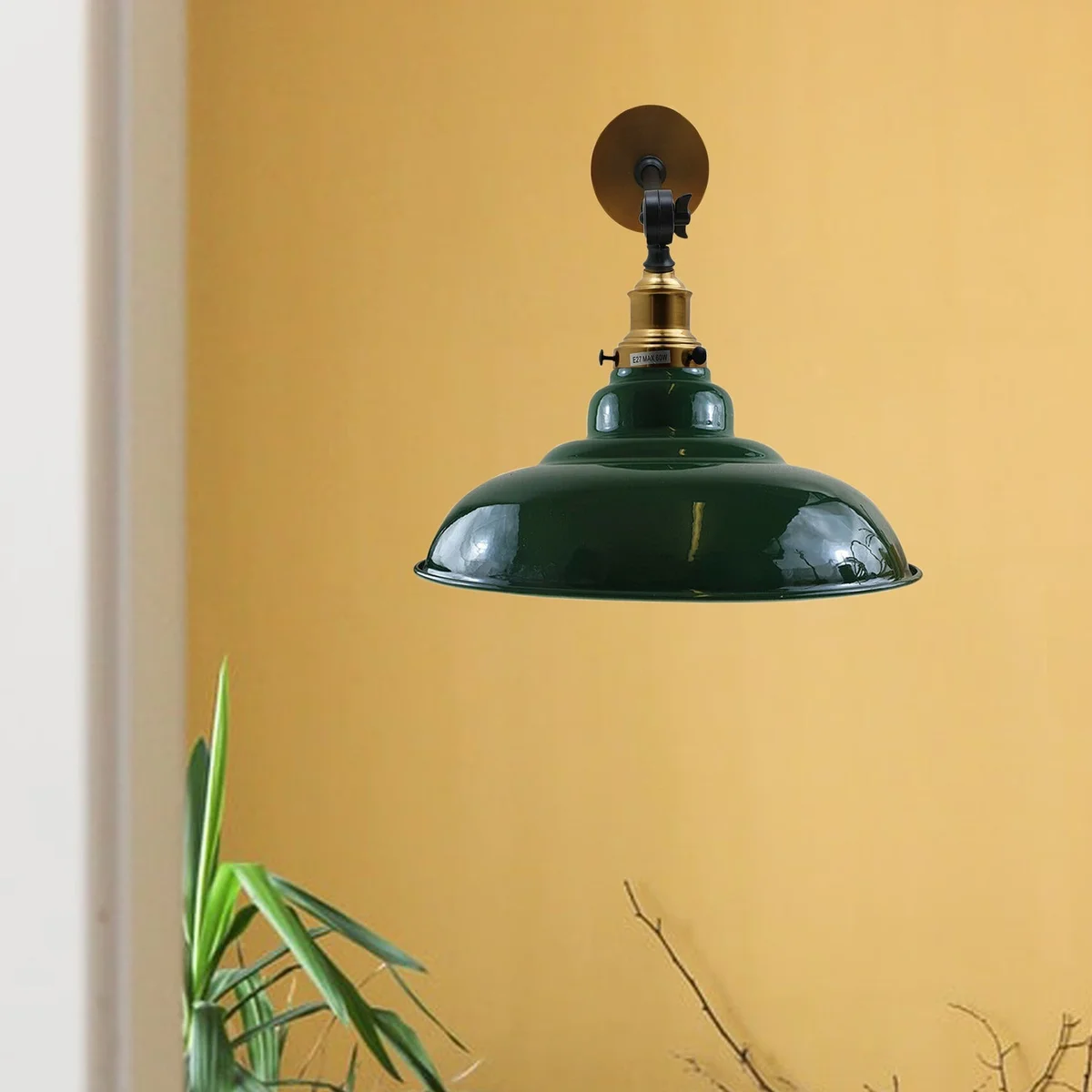 Adjustable green wall light with curved metal shade, 32 cm diameter, hanging from wall with swing arm